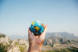 A picture of a miniature globe held in a hand